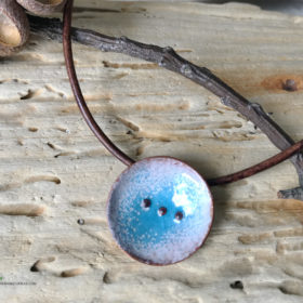 blue water pod necklace