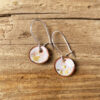 small white round earrings with gold flakes