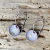 small white round enamel earrings with gold flakes